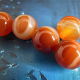 Ronde 10 - Agate naturelle rayée orange-rouge (5 pces)
