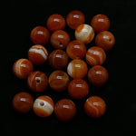 Ronde 8 - Agate naturelle rayée orange-rouge (10 pces)