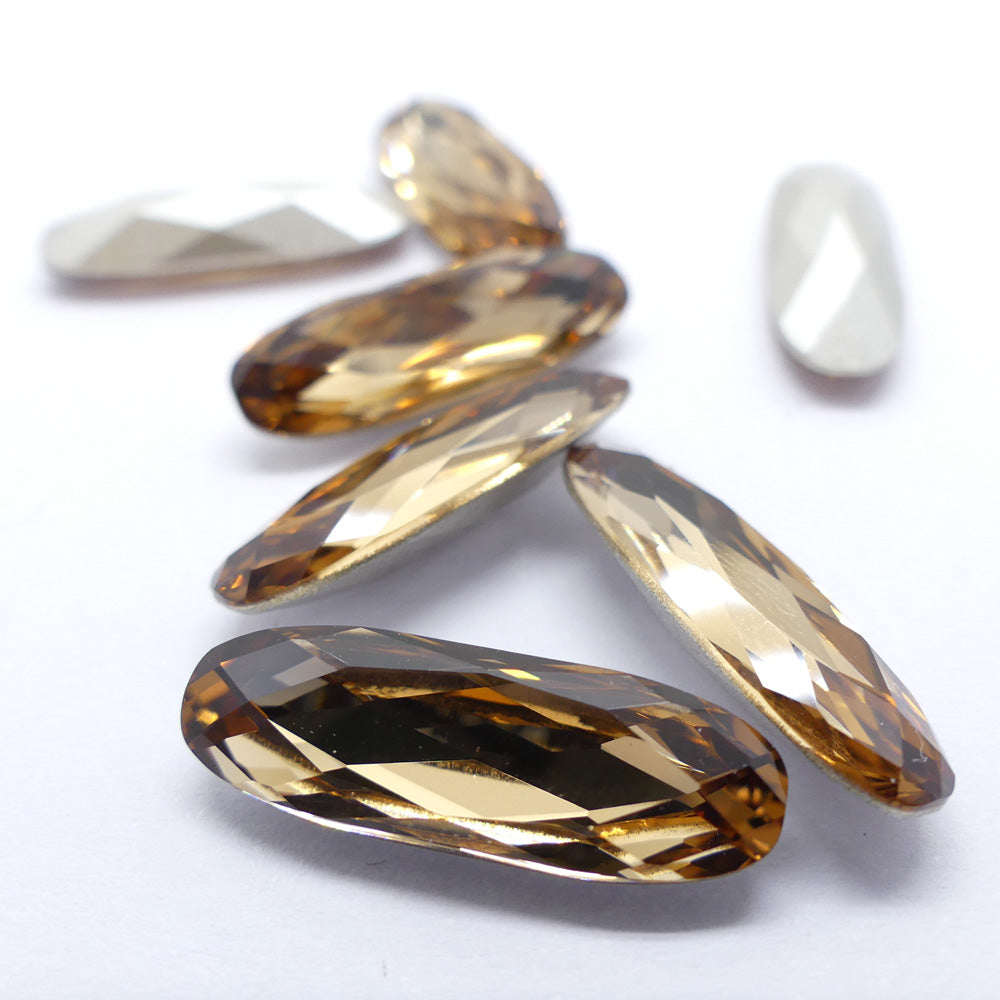 Ovale long 21 x 7 mm - Topaze claire à la pièce